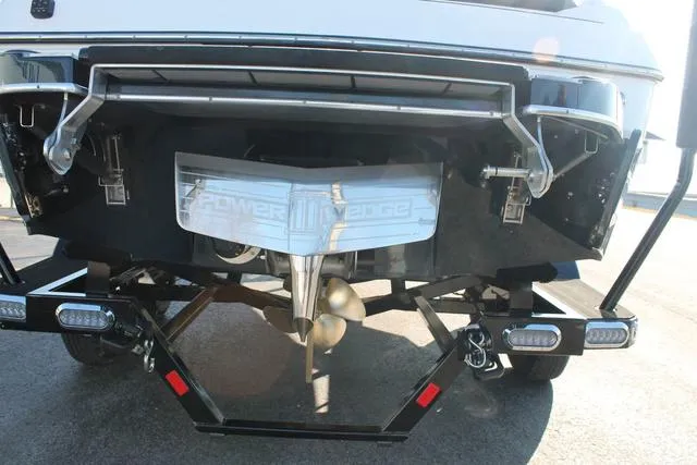 Slide: The Image of 2024 Malibu 20 VTX boat stern with Power Wedge and propeller. - 5