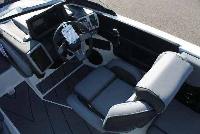 Slide: The Image of 2024 Malibu 20 VTX boat interior with modern dashboard and seating. - 6