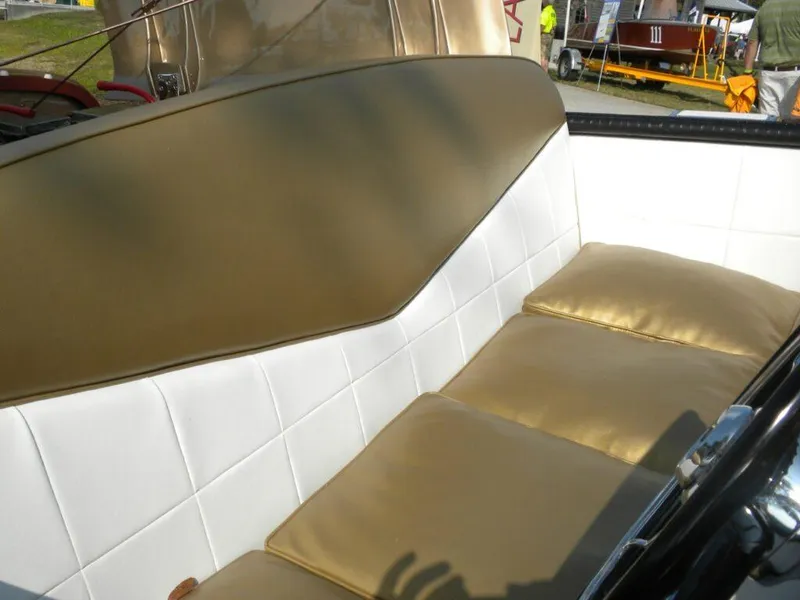 Slide: The Image of 1955 Chris-Craft Cobra 21 interior with gold and white upholstery. - 22