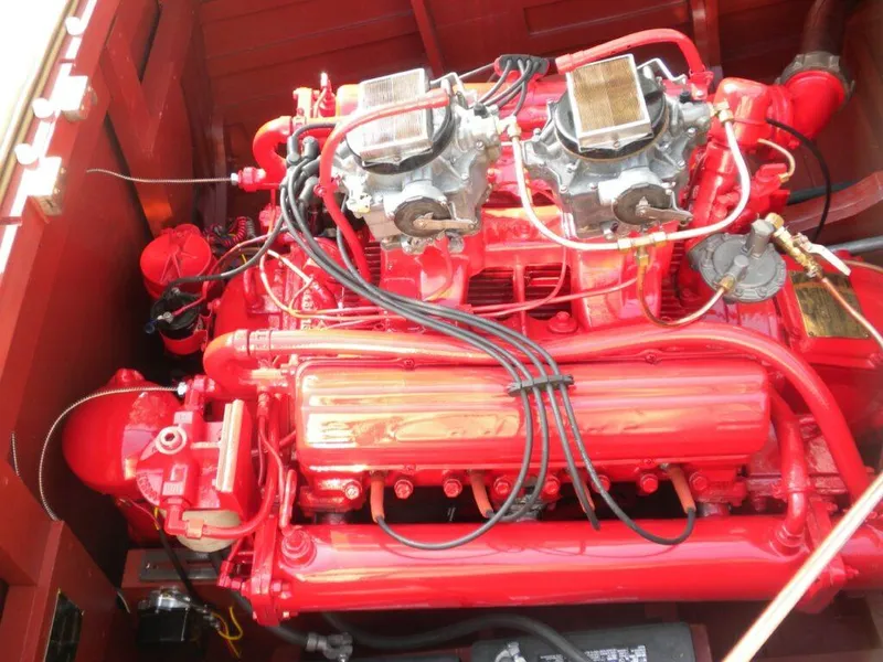 Slide: The Image of 1955 Chris-Craft Cobra 21 engine, vibrant red, detailed view. - 26
