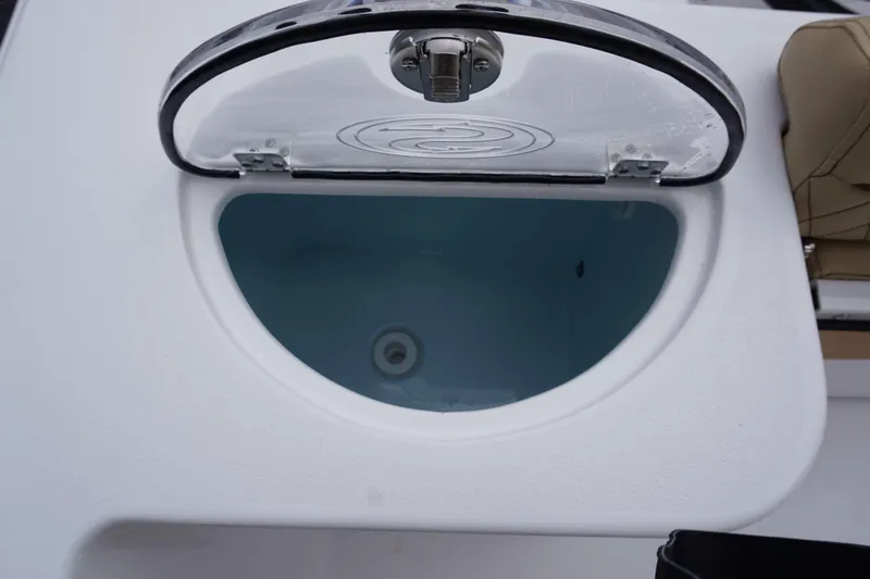 Slide: The Image of Livewell compartment of 2024 Sportsman 212 Open boat with open lid. - 16