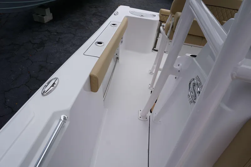 Slide: The Image of 2024 Sportsman 212 Open boat interior with beige seating and white deck. - 19