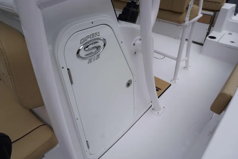 Slide: The Image of 2024 Sportsman 212 Open boat interior with storage compartment and seating. - 21