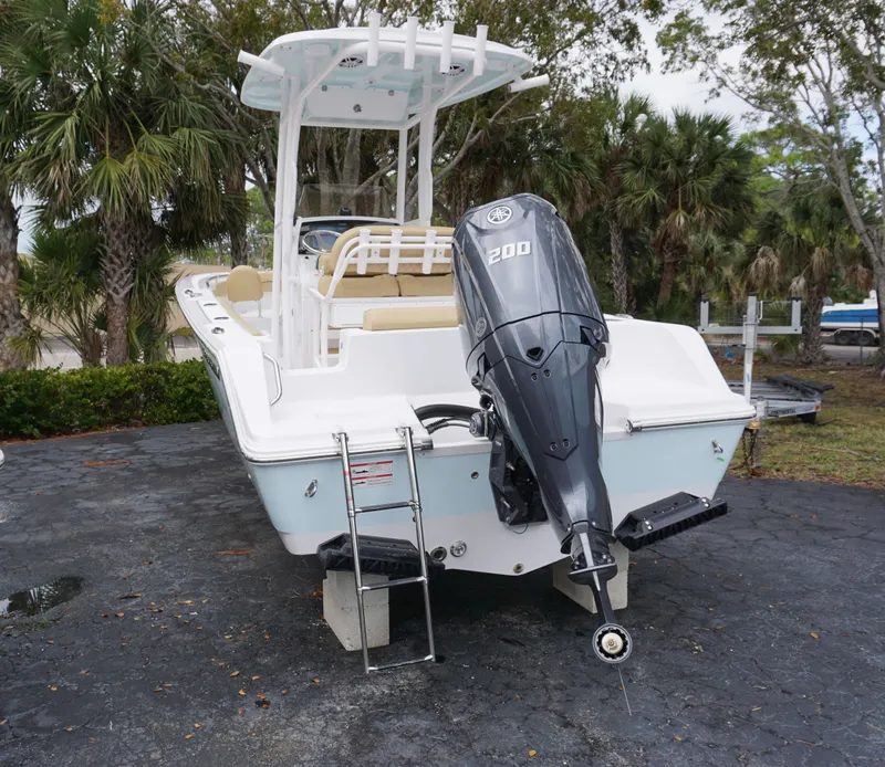 Slide: The Image of 2024 Sportsman 212 Open boat with Yamaha 200 outboard motor, rear view. - 24