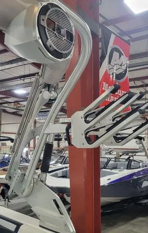 Slide: The Image of 2019 MasterCraft X22 boat with wakeboard tower and speakers in showroom. - 10