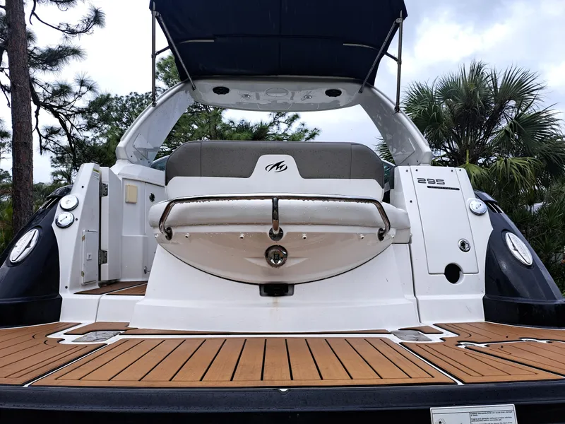 Slide: The Image of 2015 Monterey 295 Sport Yacht with teak deck and rear seating. - 13