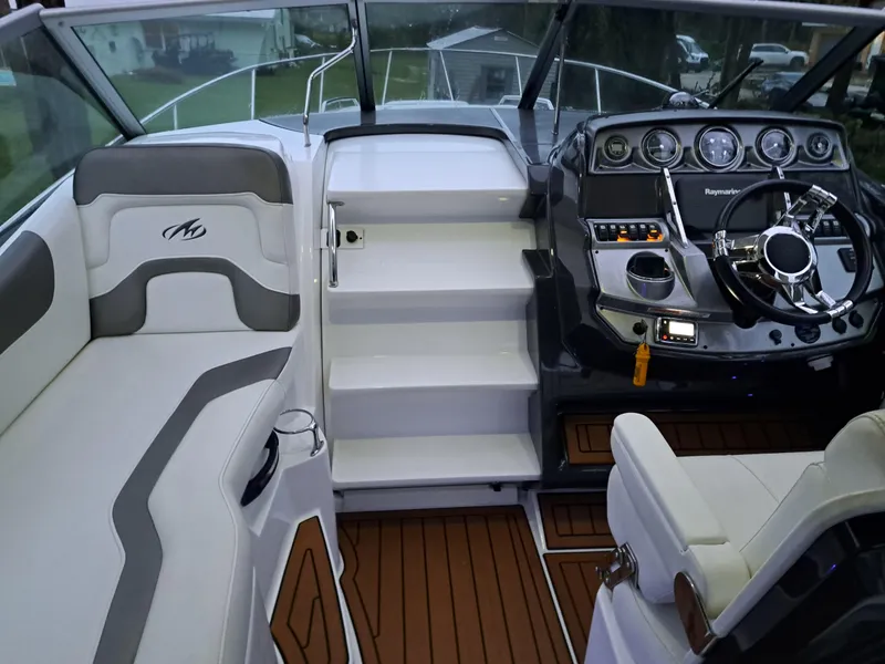 Slide: The Image of 2015 Monterey 295 Sport Yacht cockpit with modern dashboard and seating. - 17