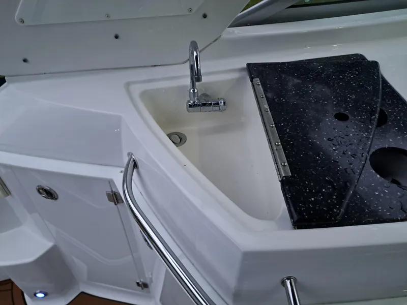 Slide: The Image of 2015 Monterey 295 Sport Yacht sink and countertop area. - 19