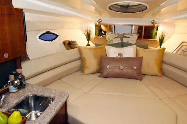 Slide: The Image of Luxurious interior of 2015 Monterey 295 Sport Yacht with plush seating and elegant decor. - 26