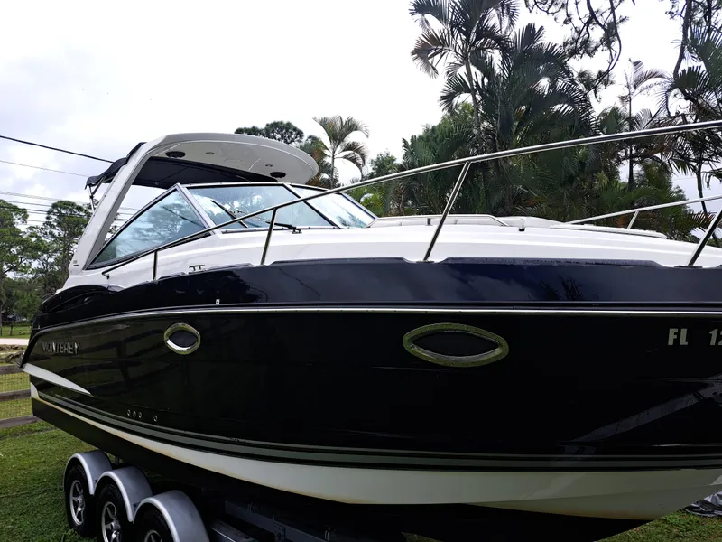 Slide: The Image of 2015 Monterey 295 Sport Yacht on a trailer, side view. - 3