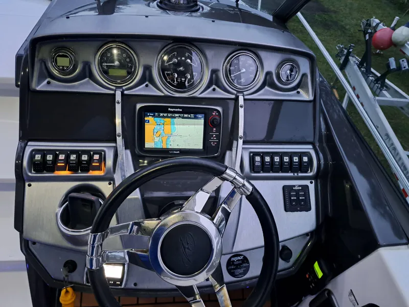 Slide: The Image of Dashboard of a 2015 Monterey 295 Sport Yacht with navigation system. - 6