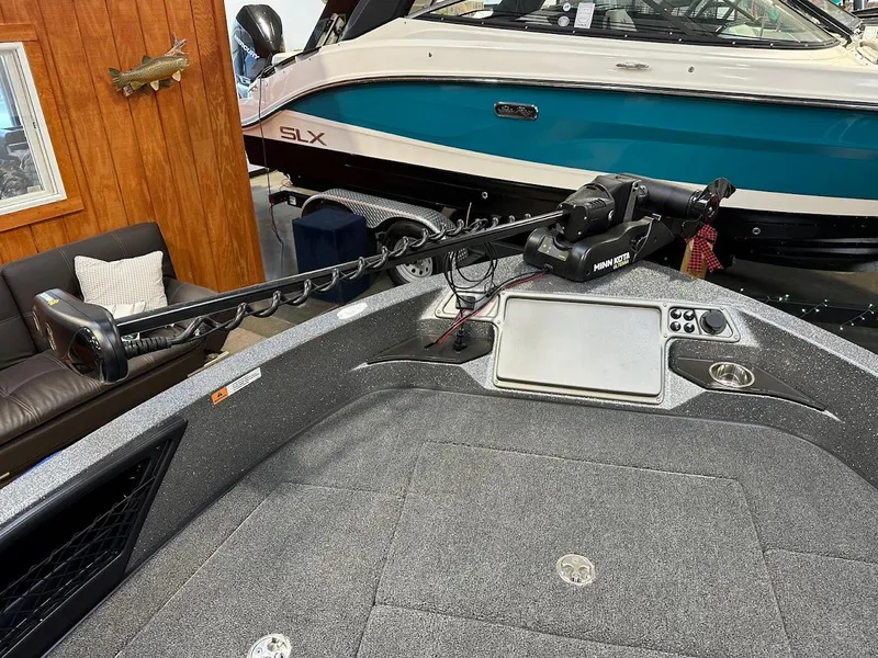 Slide: The Image of 2024 Ranger 1850MS boat interior with trolling motor and control panel. - 13
