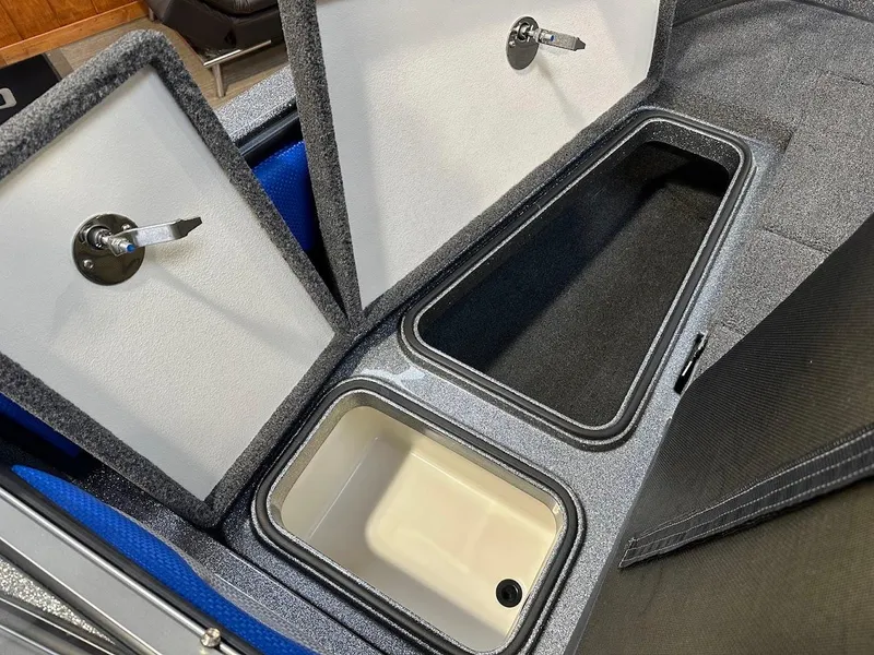 Slide: The Image of 2024 Ranger 1850MS boat storage compartments with open lids, showcasing interior space. - 25