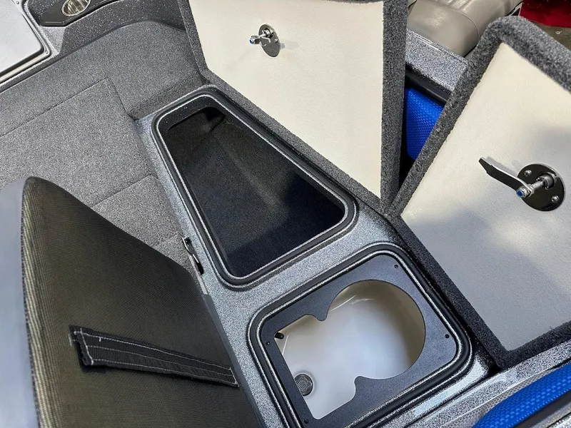 Slide: The Image of 2024 Ranger 1850MS boat storage compartments with open lids, showcasing interior space. - 26