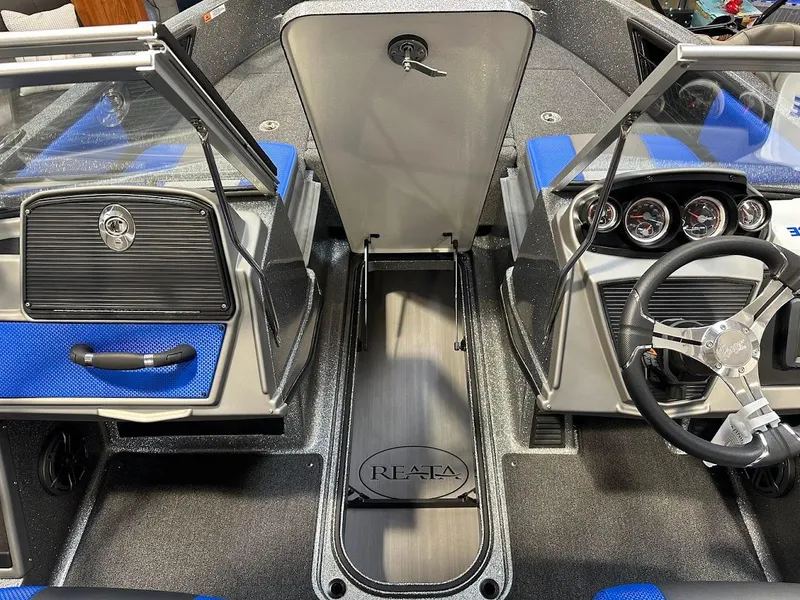 Slide: The Image of 2024 Ranger 1850MS boat interior with blue accents and steering wheel. - 27