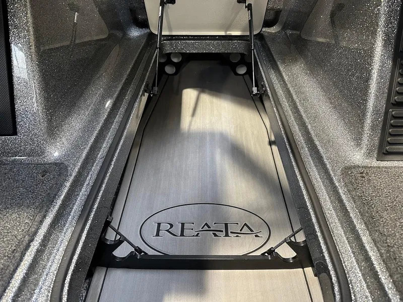 Slide: The Image of 2024 Ranger 1850MS boat interior with Reata logo on floor. - 28