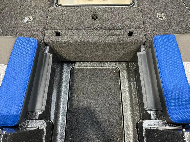 Slide: The Image of 2024 Ranger 1850MS boat interior with blue seats and storage compartments. - 29