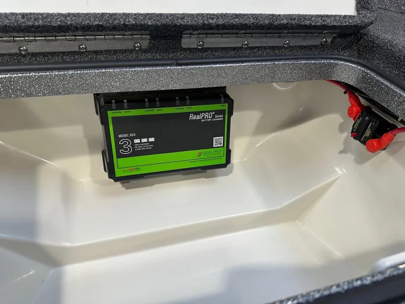 Slide: The Image of 2024 Ranger 1850MS boat battery compartment with RealPRO charger. - 31