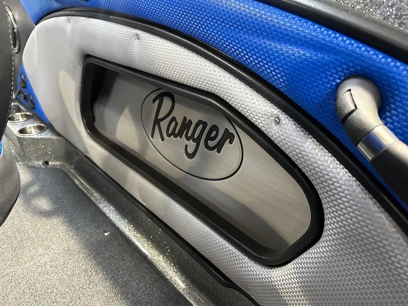 Slide: The Image of 2024 Ranger 1850MS interior detail with logo and blue accents. - 32
