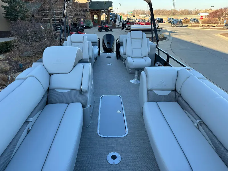 Slide: The Image of 2024 Regency 230 DL3 pontoon boat with luxurious seating and spacious deck. - 11