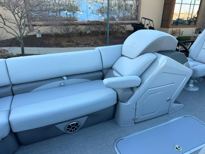 Slide: The Image of 2024 Regency 230 DL3 boat interior with plush seating and modern design. - 4