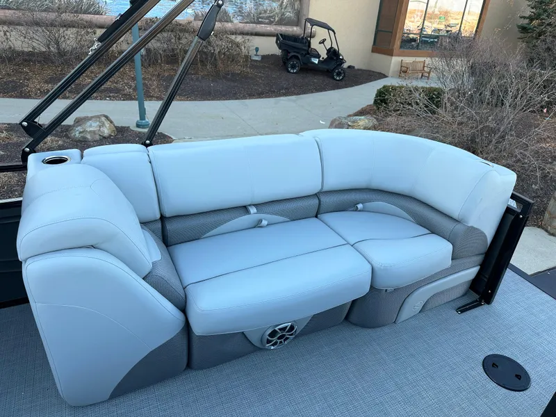 Slide: The Image of 2024 Regency 230 DL3 boat interior with plush seating and modern design. - 9