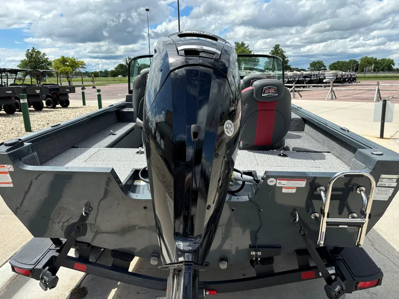 Slide: The Image of 2024 Ranger VS1682SC Angler boat with outboard motor, parked on a trailer. - 3