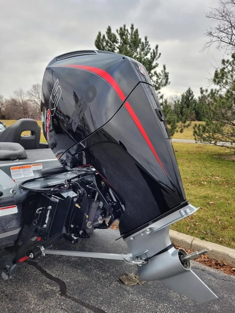 Slide: The Image of 2024 Nitro Z21 XL Pro boat engine in a parking lot. - 2