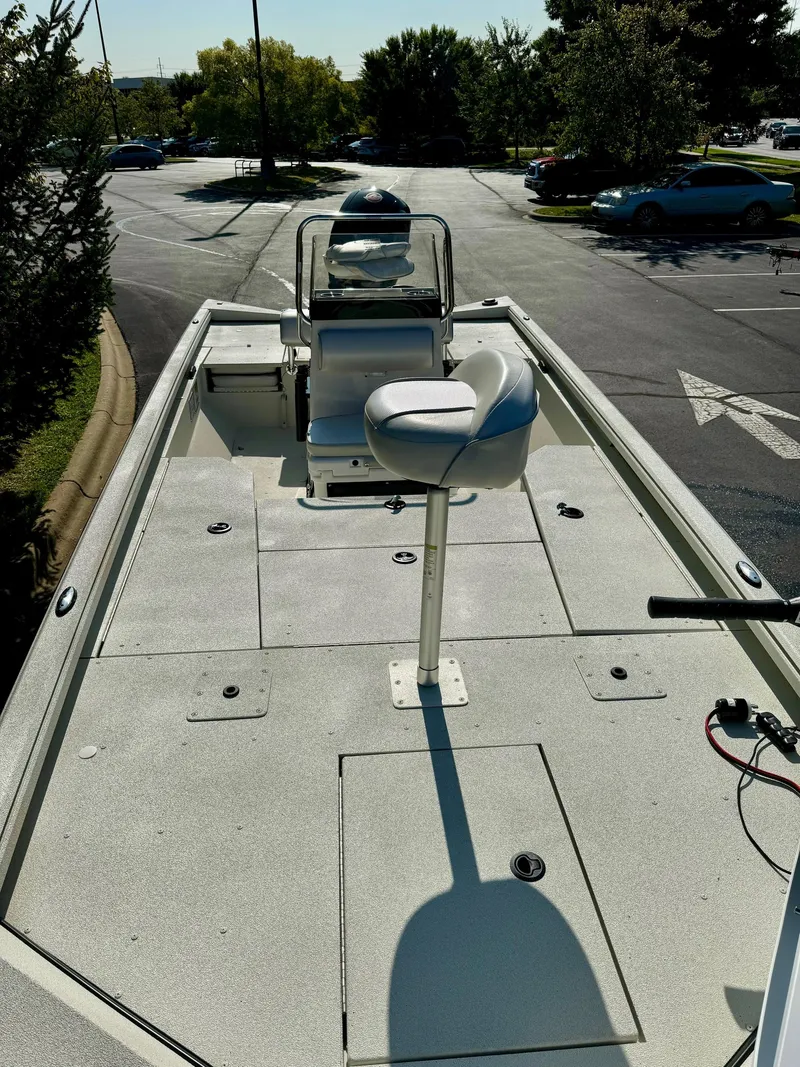Slide: The Image of 2024 Ranger RB200 boat with seating, parked in a sunny lot. - 3