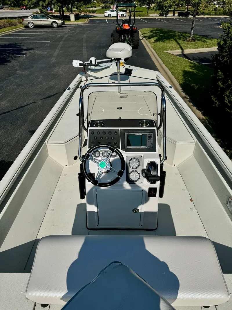 Slide: The Image of 2024 Ranger RB200 boat interior with steering console and navigation equipment. - 4