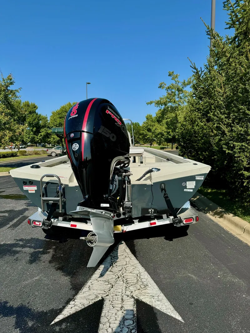 Slide: The Image of 2024 Ranger RB200 boat with powerful outboard motor on a sunny day. - 5