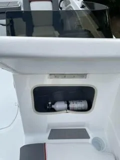 Slide: The Image of 2024 Tahoe T21 boat with built-in fire extinguisher compartment. - 11