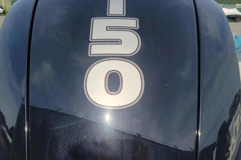 Slide: The Image of Close-up of a 2024 Tahoe 200 S outboard motor with "150" marking. - 1