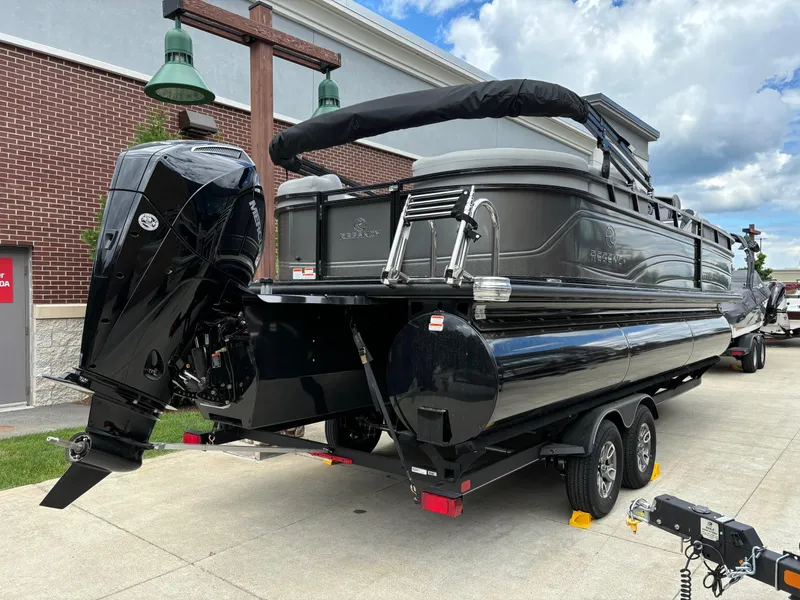 Slide: The Image of 2024 Regency 230 DL3 pontoon boat on trailer, rear view. - 3