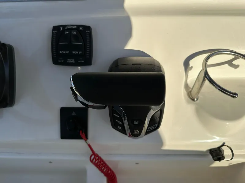 Slide: The Image of Close-up of 2024 Key West 239 FS boat controls and throttle. - 12