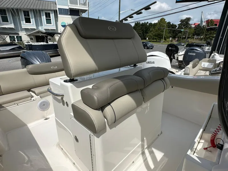 Slide: The Image of 2024 Key West 239 FS boat interior with cushioned seating and modern design. - 13