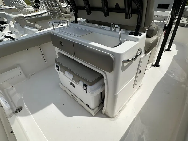 Slide: The Image of 2024 Key West 239 FS boat interior with seating and storage area. - 14