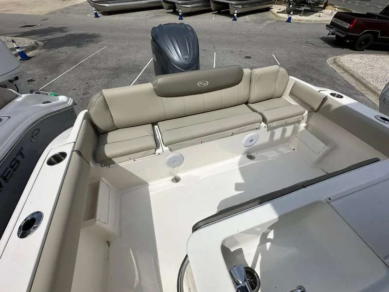 Slide: The Image of 2024 Key West 239 FS boat interior with seating and motor view. - 15