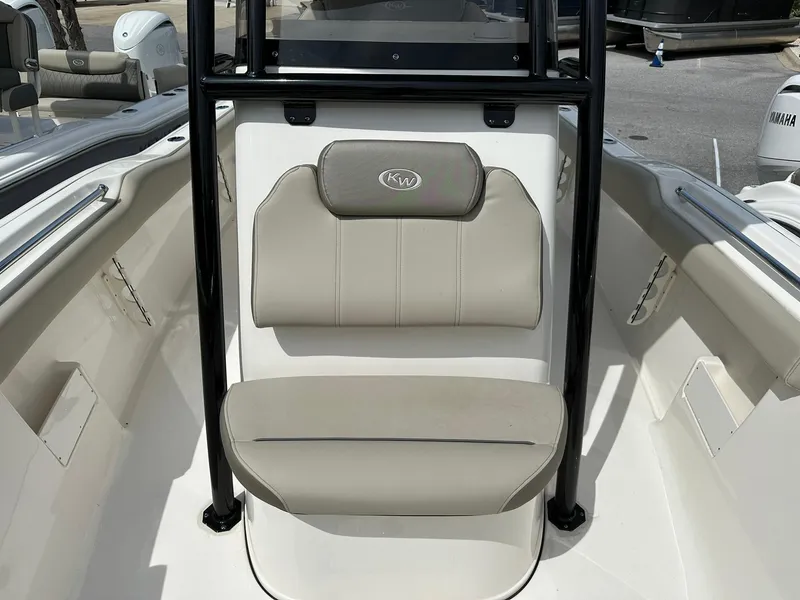 Slide: The Image of 2024 Key West 239 FS boat interior with cushioned seating and sleek design. - 5