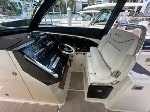 Slide: The Image of 2023 Chris-Craft Calypso 35 helm with luxurious seating and modern dashboard controls. - 17
