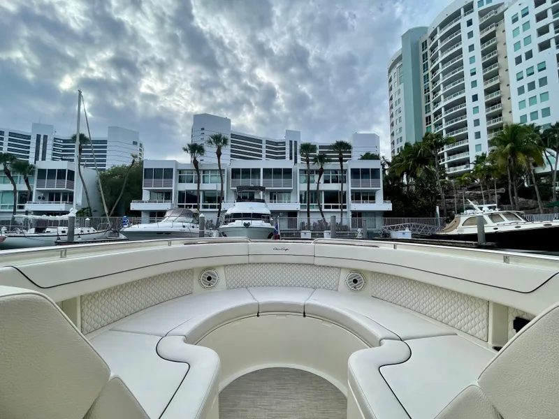 Slide: The Image of 2023 Chris-Craft Calypso 35 boat interior with marina and modern buildings in background. - 25