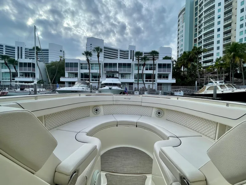 Slide: The Image of 2023 Chris-Craft Calypso 35 boat interior with marina and buildings in background. - 26
