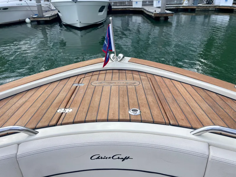 Slide: The Image of 2023 Chris-Craft Calypso 35 boat with teak deck at marina. - 27