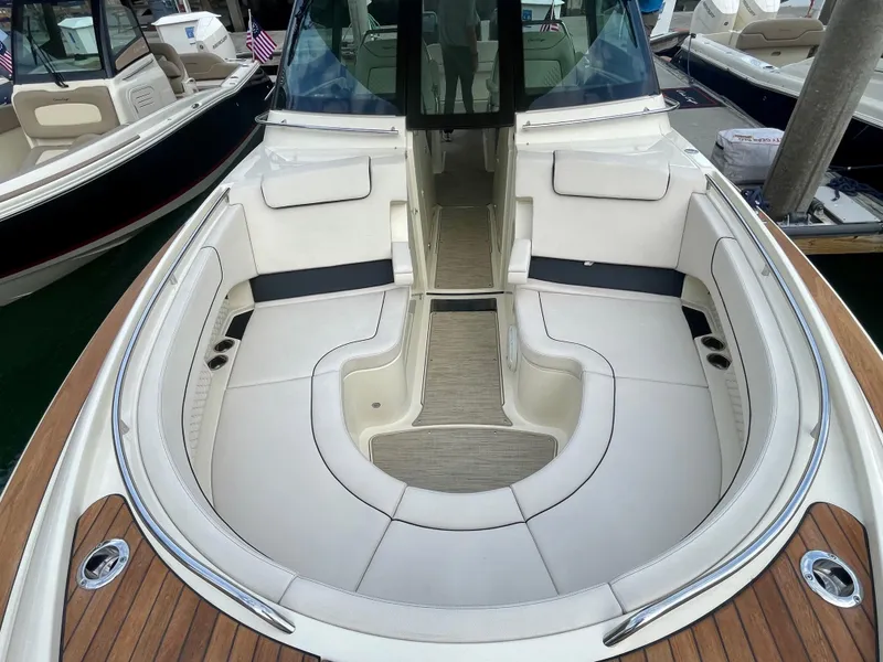 Slide: The Image of 2023 Chris-Craft Calypso 35 boat interior with elegant seating and teak accents. - 28