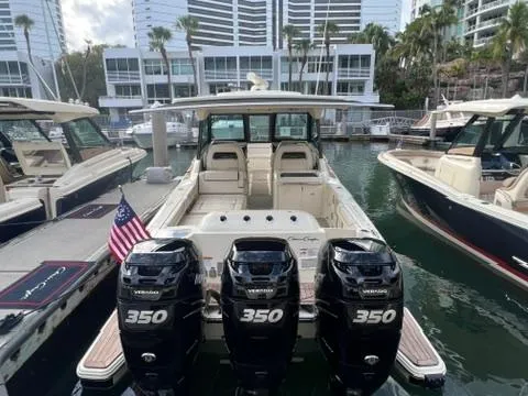 Slide: The Image of 2023 Chris-Craft Calypso 35 boat with triple 350 engines docked at marina. - 6