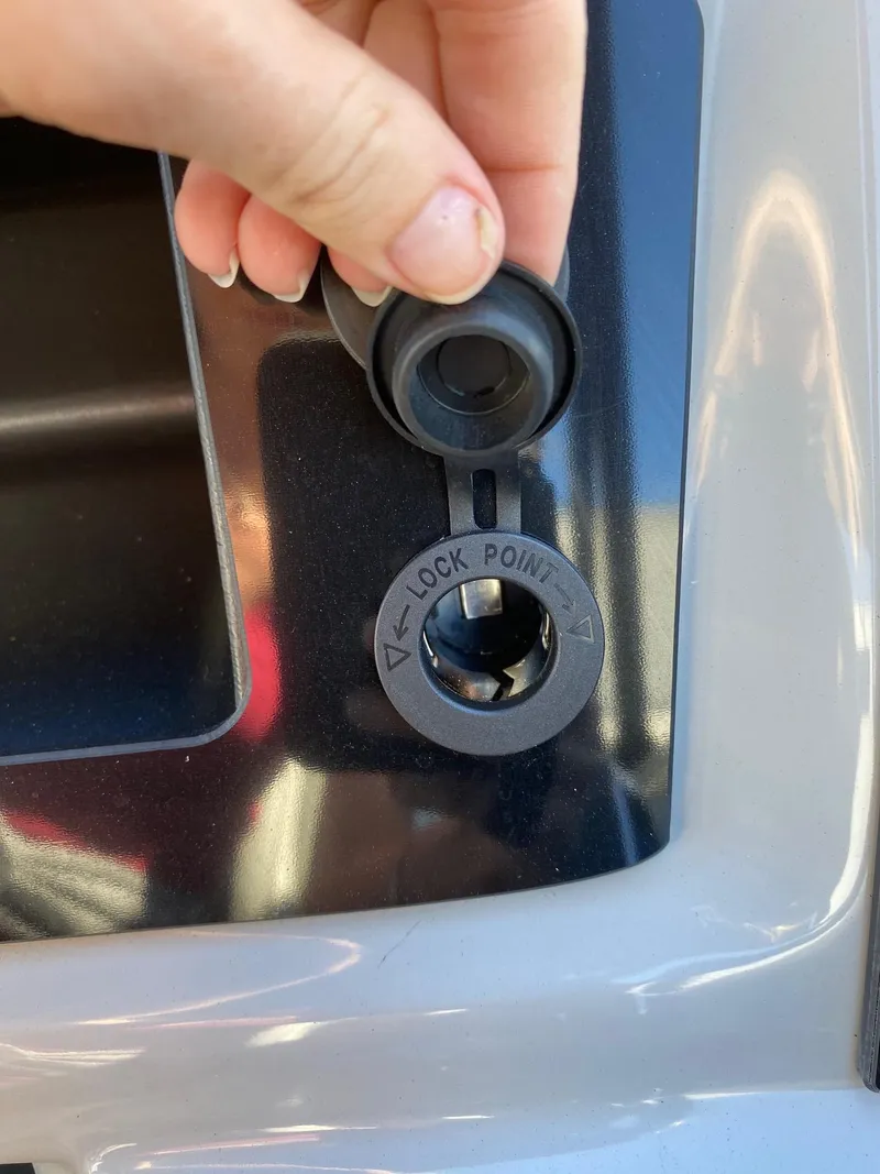 Slide: The Image of 2024 Viaggio Lago 20C lock point detail with cap being opened. - 13