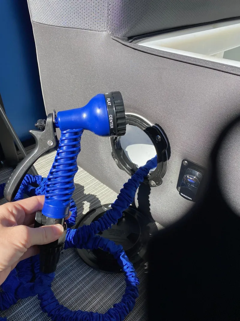 Slide: The Image of Blue hose and nozzle in Viaggio Lago 20C, 2024 model, interior detail. - 20