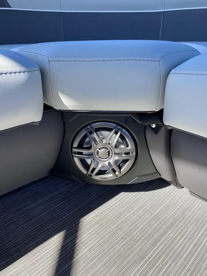 Slide: The Image of 2024 Viaggio Lago 20C boat interior with speaker and cushioned seating. - 23