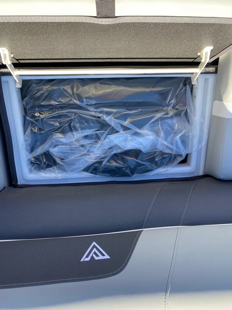 Slide: The Image of 2024 Viaggio Lago 20C storage compartment with protective covering. - 29