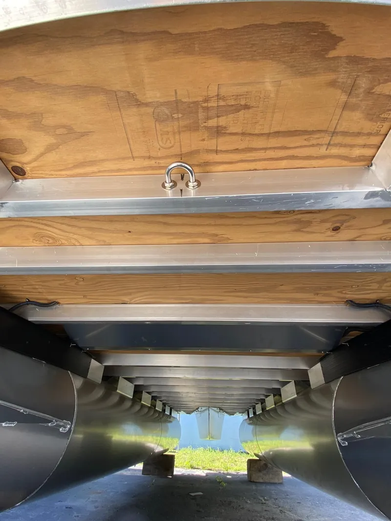 Slide: The Image of Underneath view of 2024 Viaggio Lago 20C pontoon boat, showcasing aluminum and wood construction. - 40